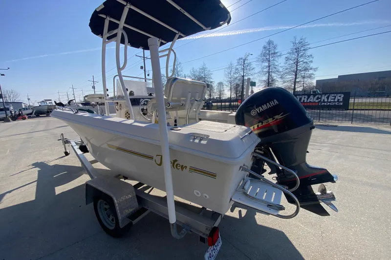 Slide: The Image of 1996 Pro-Line 170 Center Console boat with Yamaha outboard motor on trailer. - 6