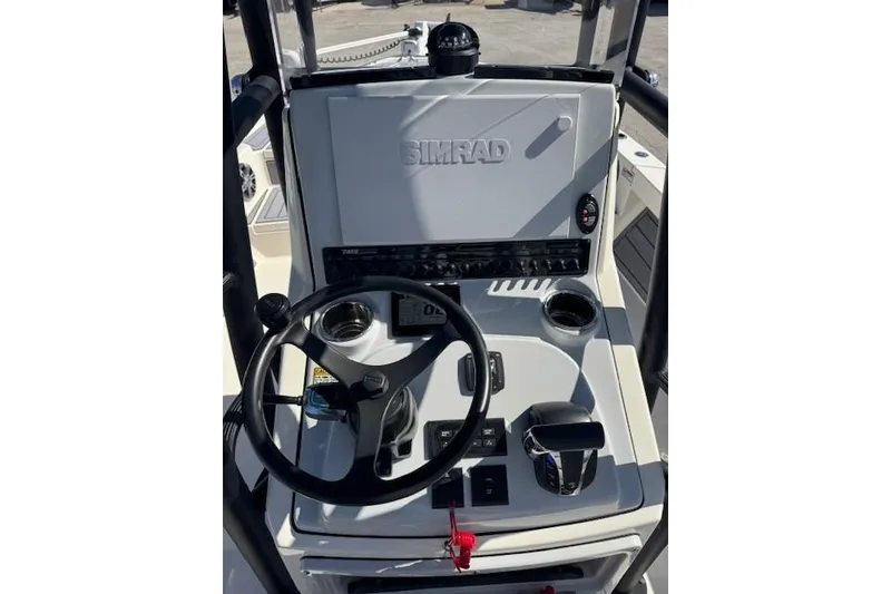 Slide: The Image of 2023 Pathfinder 2500 Hybrid boat console with Simrad navigation system and steering wheel. - 10