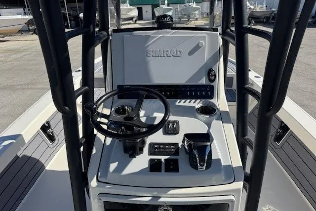 Slide: The Image of 2023 Pathfinder 2500 Hybrid boat console with steering wheel and controls. - 5