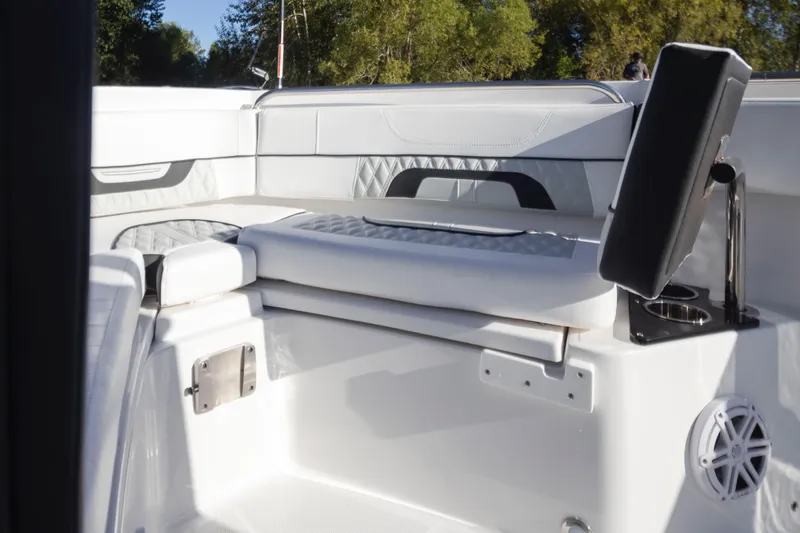 Slide: The Image of 2024 Blackfin 222 CC boat interior with cushioned seating and modern design. - 17