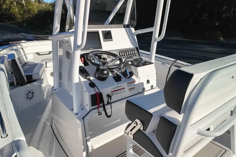 Slide: The Image of 2024 Blackfin 222 CC boat interior with modern helm and seating. - 24