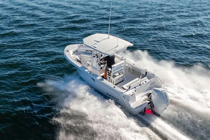 Slide: The Image of 2024 Blackfin 222 CC boat cruising on open water, showcasing speed and performance. - 8