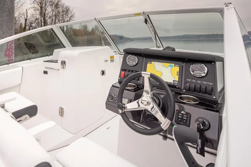Slide: The Image of 2024 Blackfin 232DC Dual Console boat interior with modern dashboard and steering wheel. - 15