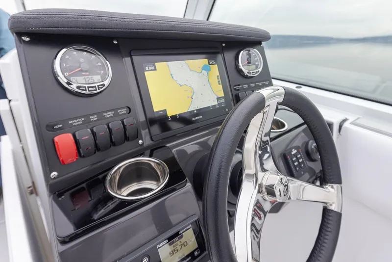 Slide: The Image of 2024 Blackfin 232DC Dual Console dashboard with navigation display and controls. - 16