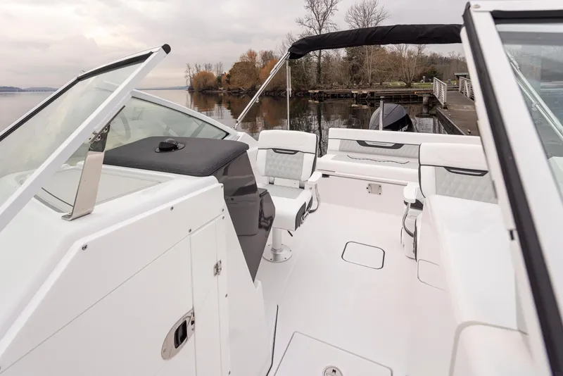 Slide: The Image of 2024 Blackfin 232DC Dual Console boat interior with white seating and sleek design. - 22