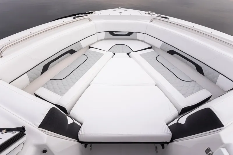 Slide: The Image of 2024 Blackfin 232DC Dual Console boat interior with white cushioned seating. - 23