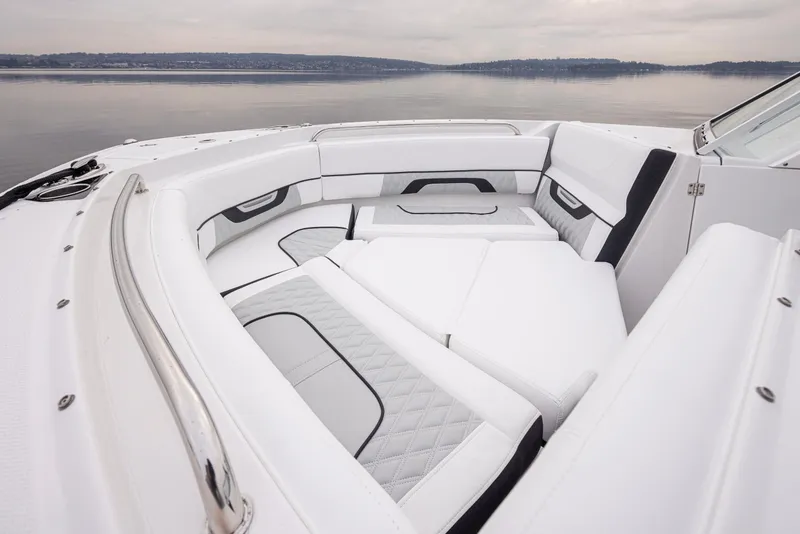 Slide: The Image of 2024 Blackfin 232DC Dual Console boat with luxurious white seating and sleek design. - 24