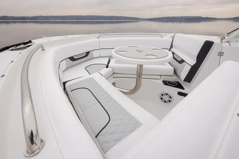 Slide: The Image of 2024 Blackfin 232DC Dual Console boat interior with white seating and round table. - 25
