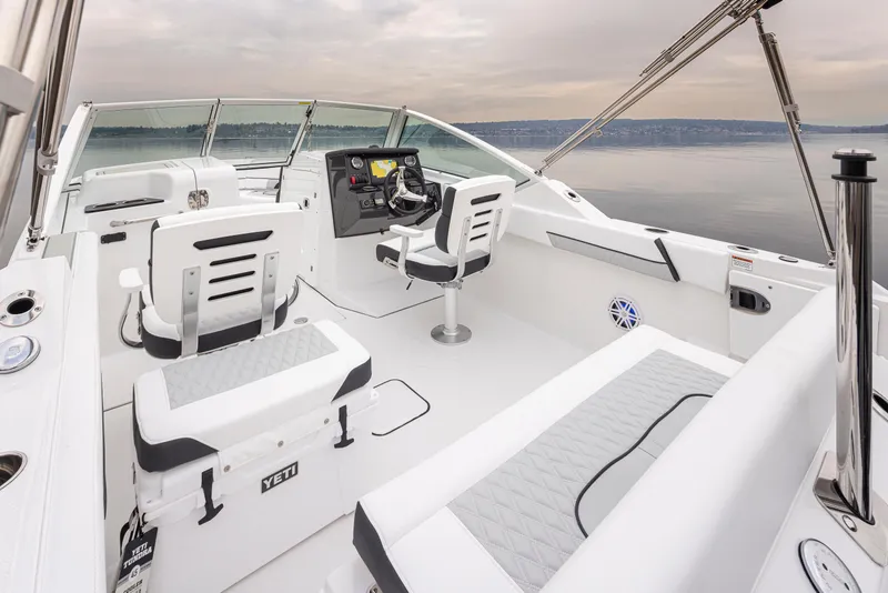 Slide: The Image of 2024 Blackfin 232DC Dual Console boat interior with modern seating and controls. - 7