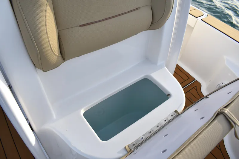 Slide: The Image of 2018 Sea Hunt BX 22 BR boat seat with storage compartment open. - 11