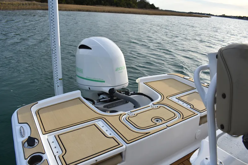 Slide: The Image of 2018 Sea Hunt BX 22 BR boat with Yamaha 200 engine on calm water. - 12