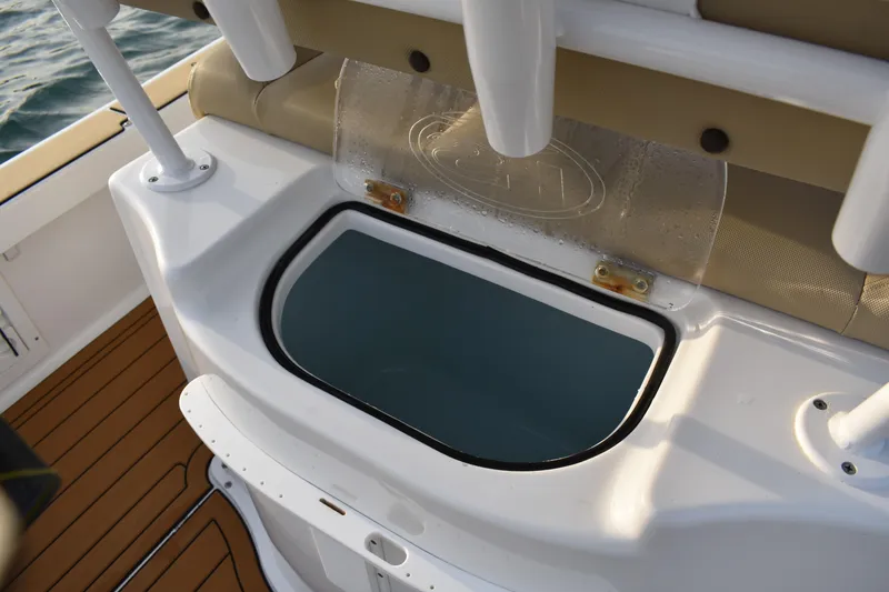 Slide: The Image of 2018 Sea Hunt BX 22 BR boat with open storage compartment on deck. - 20