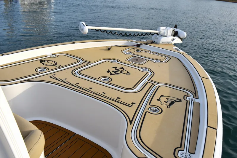 Slide: The Image of 2018 Sea Hunt BX 22 BR boat deck with fishing rod holder and fish graphics. - 5