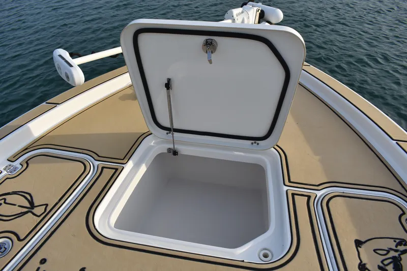 Slide: The Image of 2018 Sea Hunt BX 22 BR boat with open storage compartment on deck. - 7