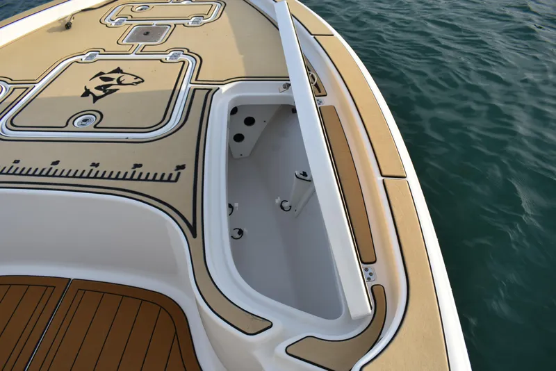 Slide: The Image of 2018 Sea Hunt BX 22 BR boat deck with fish ruler and storage compartment. - 8
