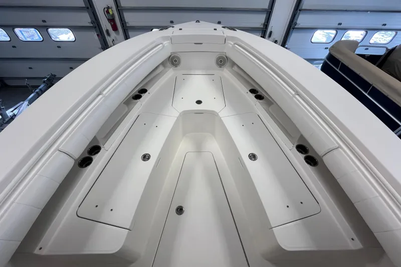Slide: The Image of 2015 Regulator 25 boat interior with spacious seating and storage compartments. - 15
