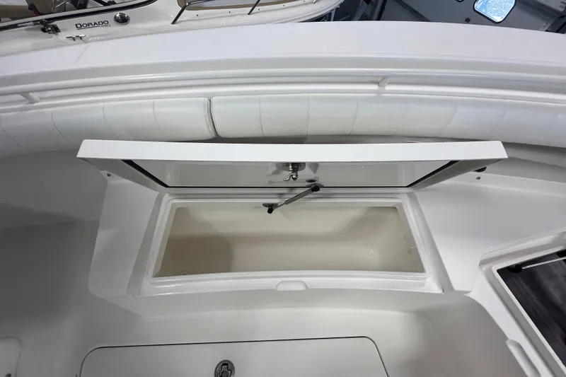 Slide: The Image of 2015 Regulator 25 boat storage compartment with open hatch. - 19