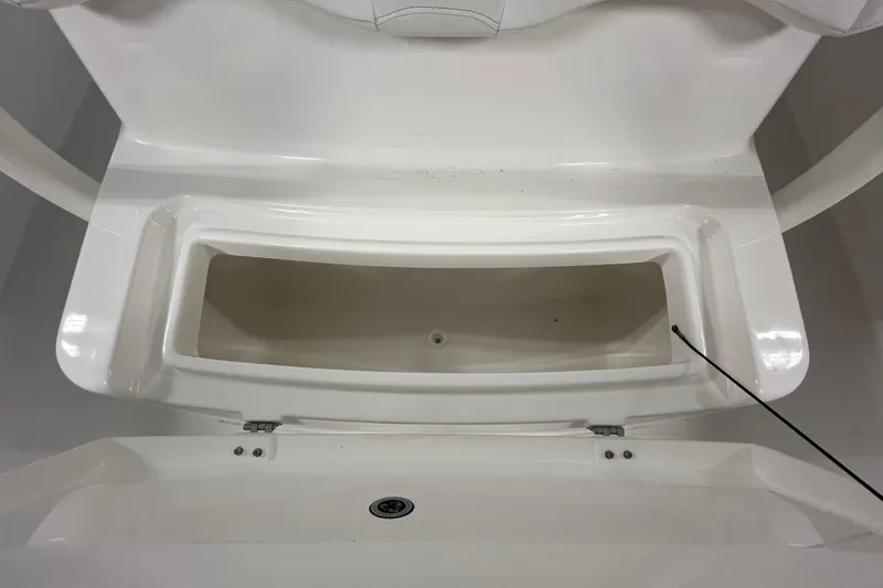 Slide: The Image of 2015 Regulator 25 boat storage compartment, open and empty, showcasing interior space. - 51