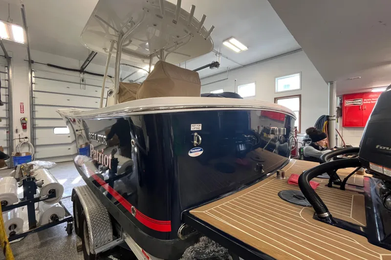 Slide: The Image of 2015 Regulator 25 boat in garage, featuring sleek design and modern equipment. - 6