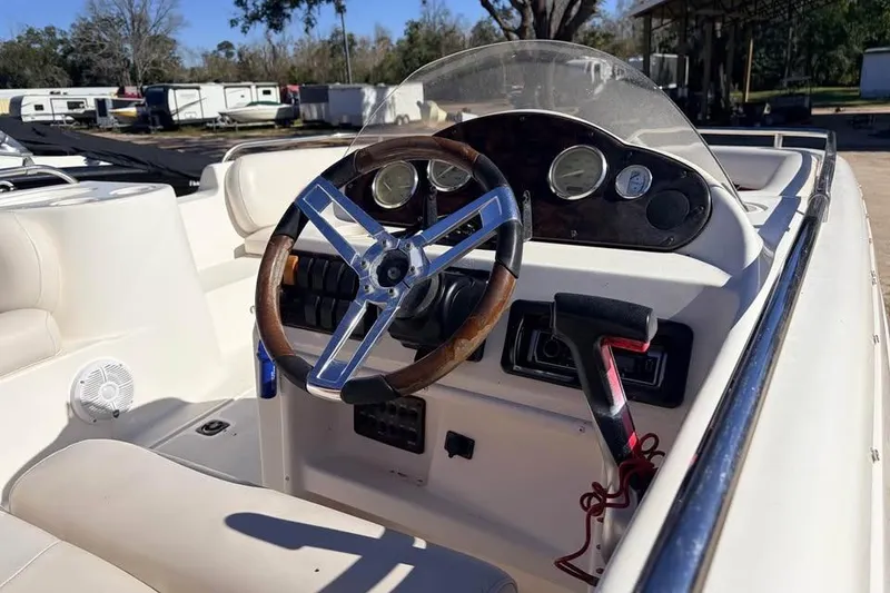 Slide: The Image of 2007 Hurricane FunDeck GS 201 OB boat dashboard with steering wheel and controls. - 4