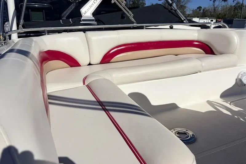Slide: The Image of 2007 Hurricane FunDeck GS 201 OB boat interior with white and red seating. - 6