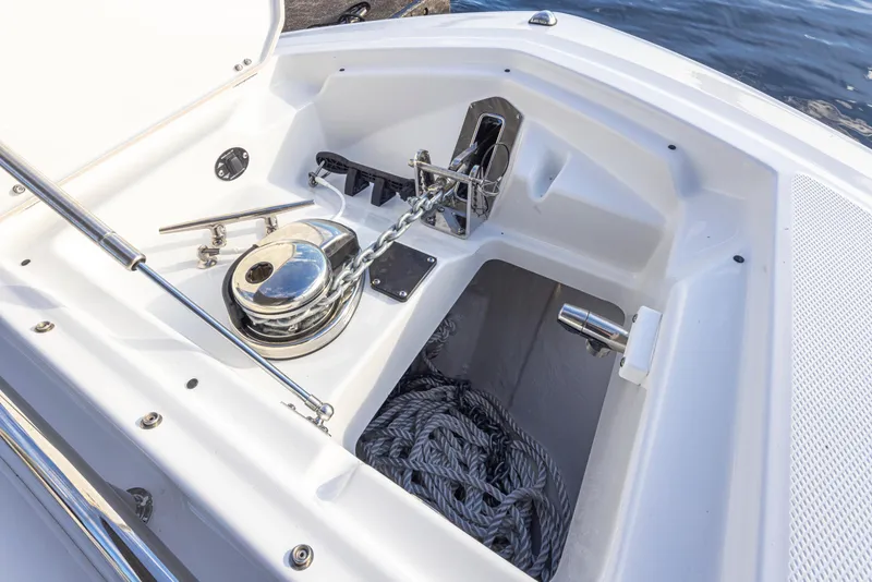 Slide: The Image of 2024 Blackfin 252 DC boat anchor compartment with chain and rope storage. - 38
