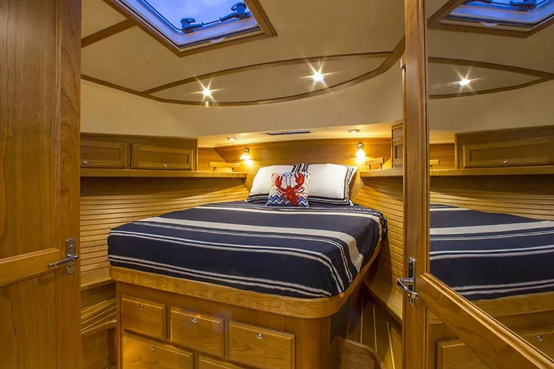 Slide: The Image of Luxurious cabin interior of 2026 Sabre 38 Salon Express yacht with wood finish and skylight. - 14