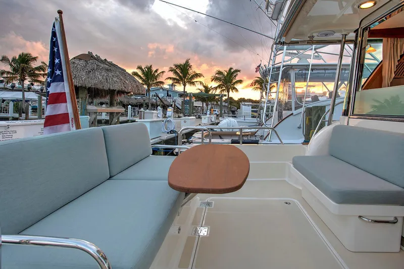 Slide: The Image of Manufacturer Provided Image: 2026 Sabre 38 Salon Express yacht with sunset view, featuring comfortable seating and elegant design. - 4