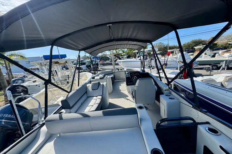 Slide: The Image of 2026 Avalon Catalina Platinum Versatile Rear Bench boat with spacious seating and canopy. - 14