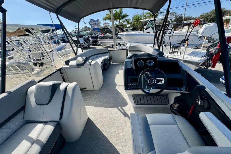 Slide: The Image of 2026 Avalon Catalina Platinum Versatile Rear Bench boat interior with modern seating and controls. - 18