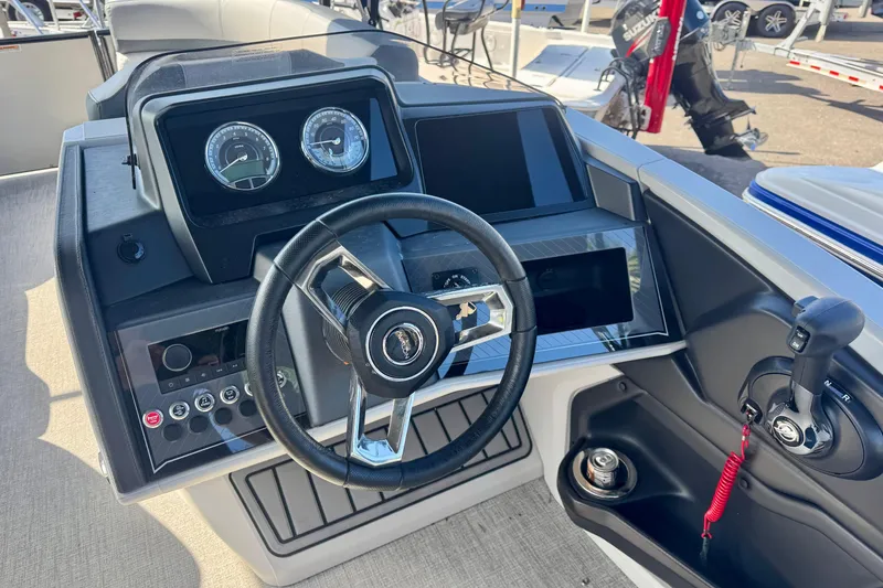 Slide: The Image of Steering console of 2026 Avalon Catalina Platinum Versatile Rear Bench boat. - 19