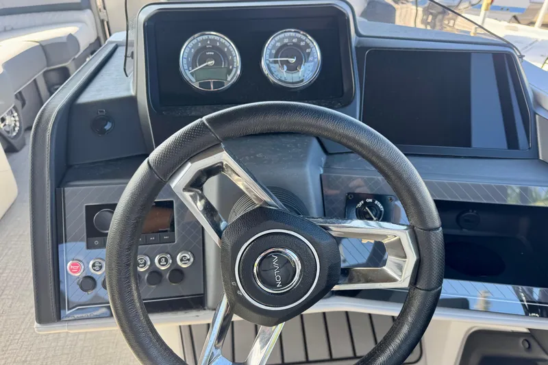 Slide: The Image of Steering wheel and dashboard of 2026 Avalon Catalina Platinum Versatile Rear Bench boat. - 20