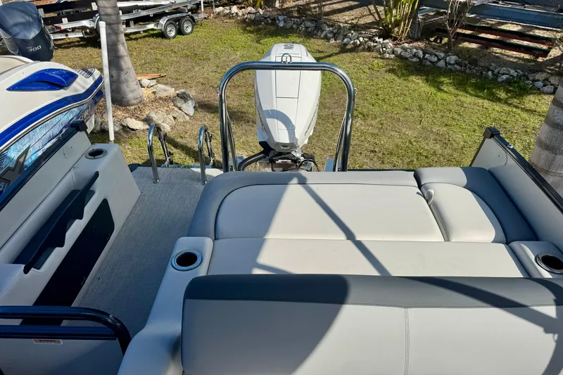 Slide: The Image of 2026 Avalon Catalina Platinum Versatile Rear Bench boat with plush seating and sleek design. - 32