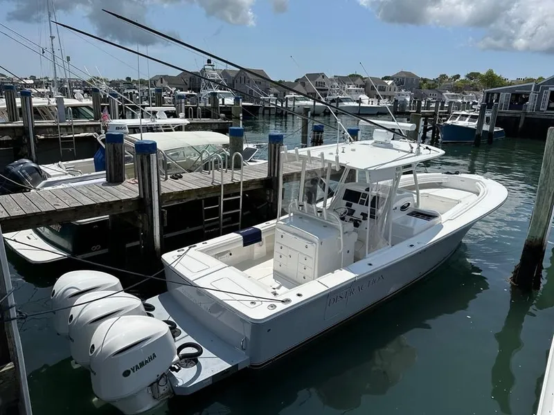 Slide: The Image of 2019 Regulator 34SS boat docked at a marina with Yamaha engines. - 21