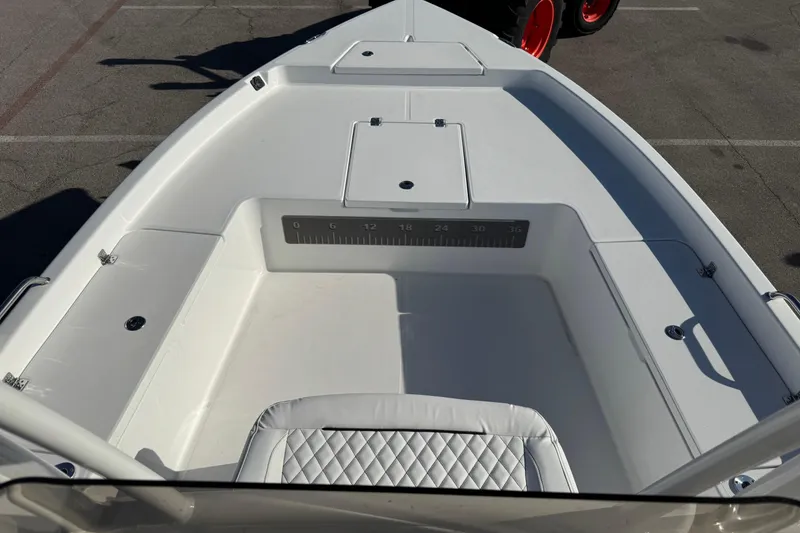Slide: The Image of 2025 Savannah 210X boat interior with white seating and storage compartments. - 3