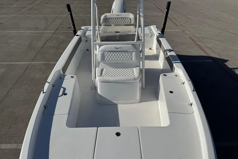 Slide: The Image of 2025 Savannah 210X boat interior with white seating and storage compartments. - 4