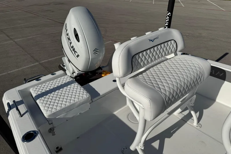 Slide: The Image of 2025 Savannah 210X boat interior with Suzuki engine and quilted seating. - 5
