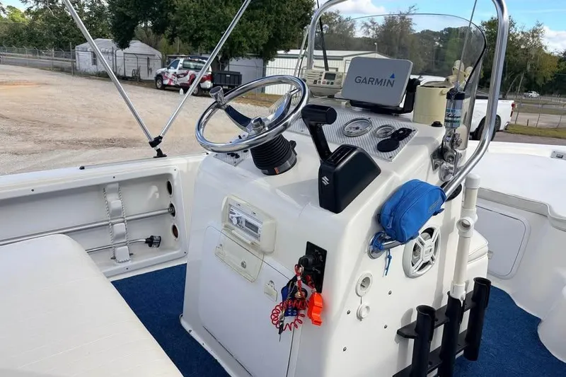 Slide: The Image of 2003 Sea Chaser 1900 CC boat console with Garmin navigation system and steering wheel. - 11