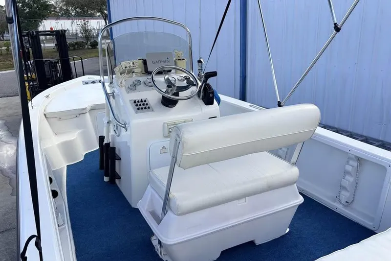 Slide: The Image of 2003 Sea Chaser 1900 CC boat interior with steering console and seating. - 4