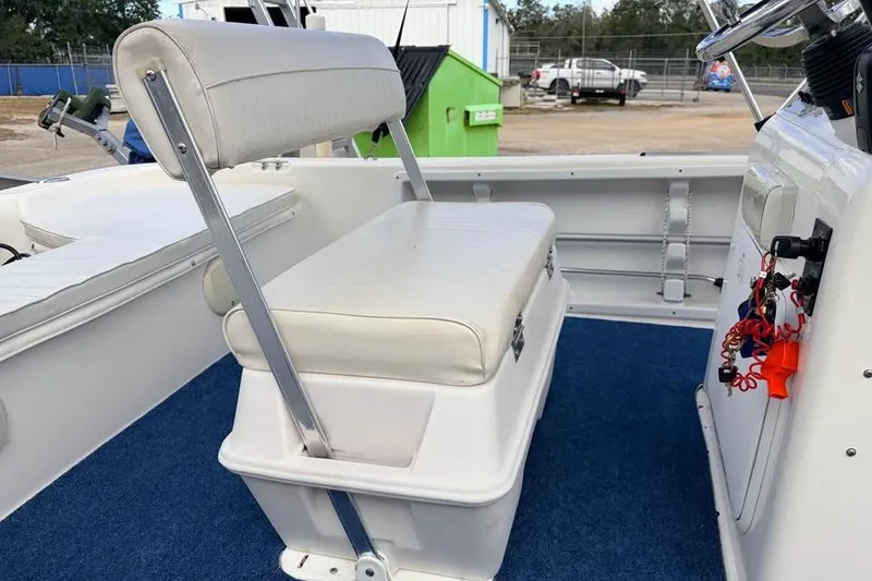 Slide: The Image of 2003 Sea Chaser 1900 CC boat interior with white seating and blue carpet. - 8