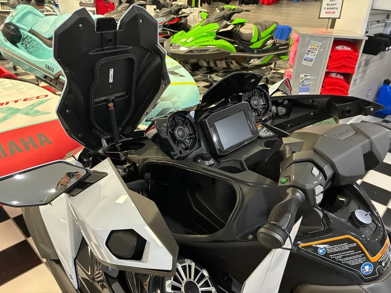 Slide: The Image of Kawasaki JET SKI ULTRA 160LX 2026 in showroom with open storage compartment. - 10
