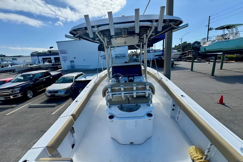 Slide: The Image of 2017 Sportsman Heritage 251 Center Console boat in a parking lot, showcasing helm and seating. - 16
