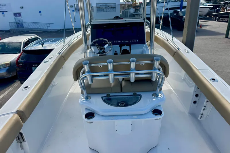 Slide: The Image of 2017 Sportsman Heritage 251 Center Console boat interior with steering wheel and seating. - 17