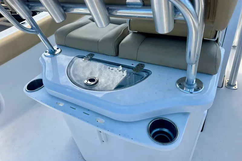 Slide: The Image of 2017 Sportsman Heritage 251 Center Console boat interior with rod holders and seating. - 18