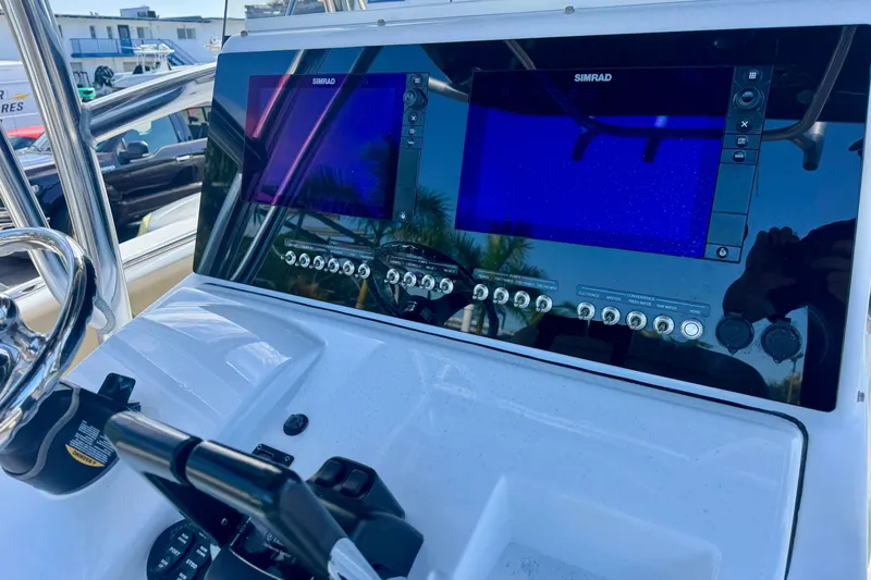 Slide: The Image of 2017 Sportsman Heritage 251 Center Console dashboard with dual Simrad displays. - 21