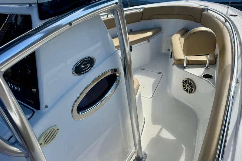 Slide: The Image of 2017 Sportsman Heritage 251 Center Console boat interior with seating and console details. - 23