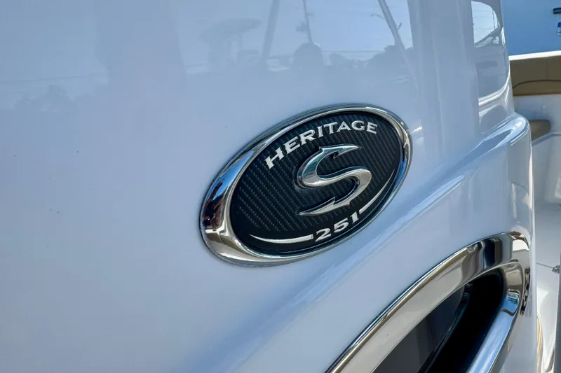 Slide: The Image of 2017 Sportsman Heritage 251 Center Console emblem on boat exterior. - 24