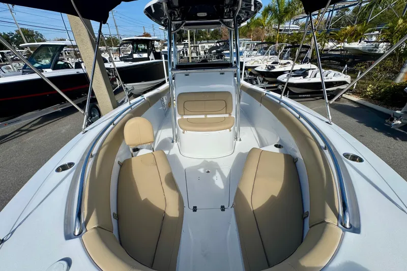 Slide: The Image of 2017 Sportsman Heritage 251 Center Console boat with tan seating and sleek design. - 27