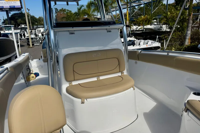 Slide: The Image of 2017 Sportsman Heritage 251 Center Console boat interior with tan seating and sleek design. - 30