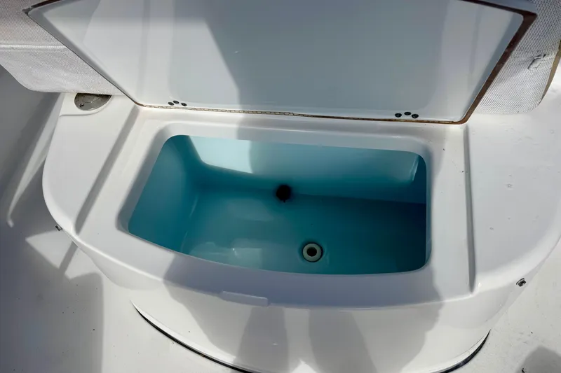 Slide: The Image of 2017 Sportsman Heritage 251 Center Console livewell with open lid. - 32